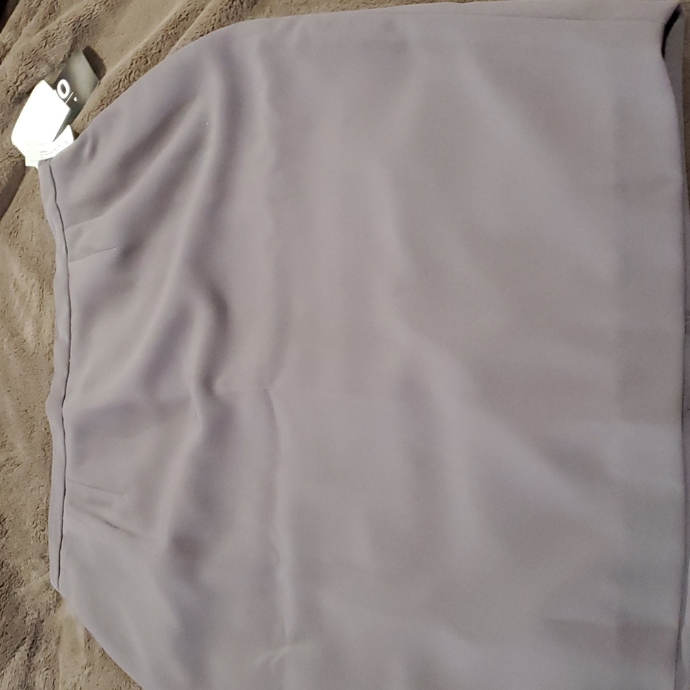 Fully lined gray skirt.
